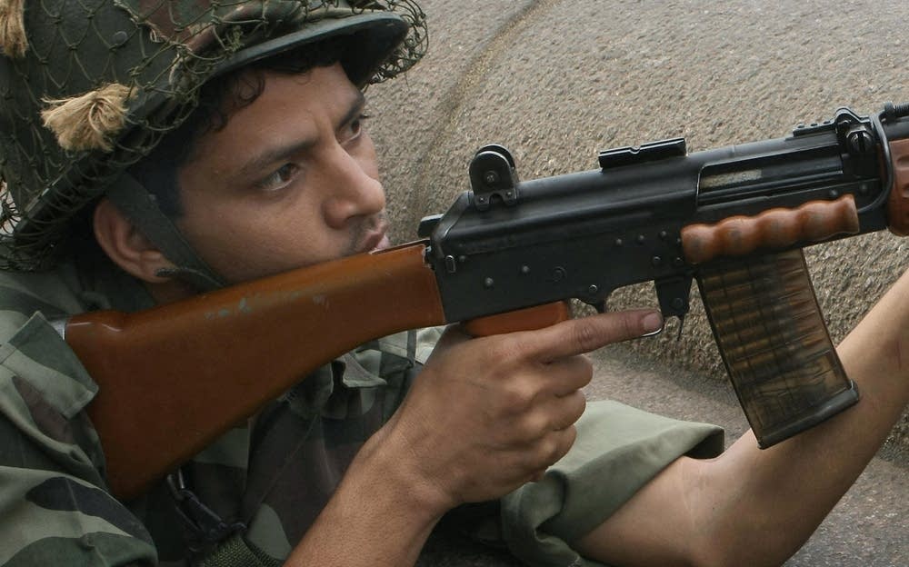 An Indian army soldier holds position ou
