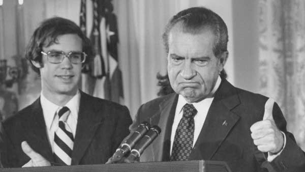 Richard Nixon gives the thumbs up as he addresses the White House staff upon his resignation as 37th President of the United States, Washington, D.C., in 1974. His son-in-law, David Eisenhower, is with him on the left. 