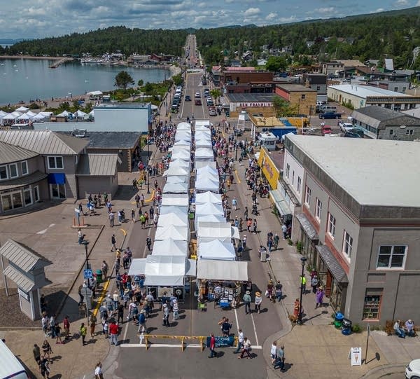 An aerial view of an arts festival in downtown Grand Marais.