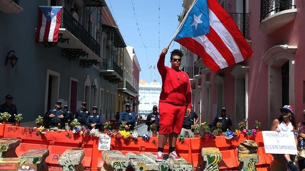 Protesters demand the resignation of Puerto Rico's Governor Ricardo Rosselló.