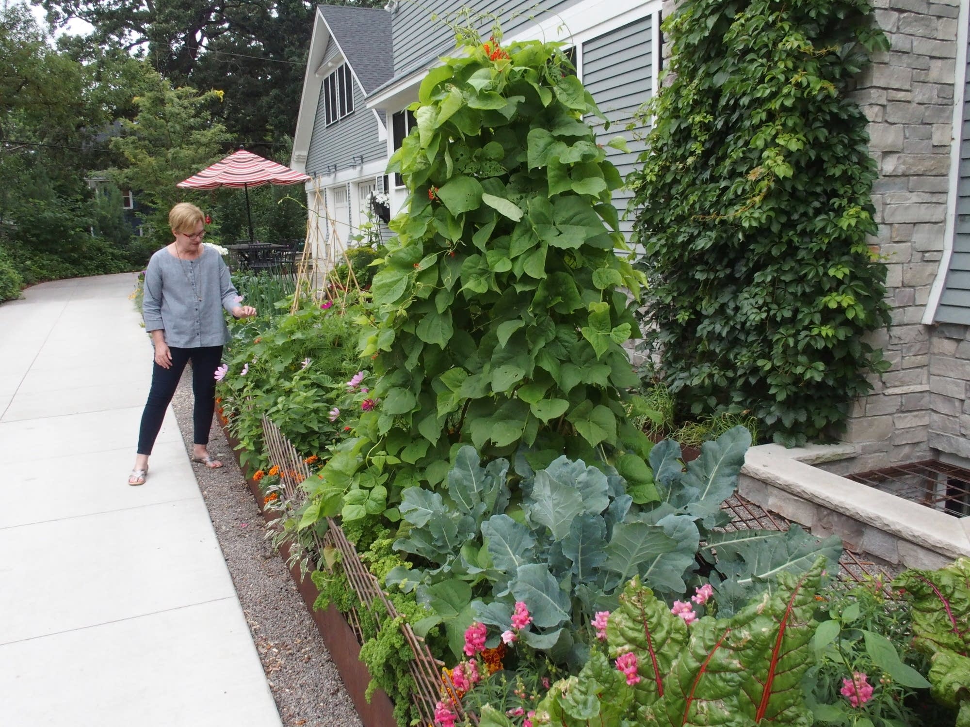 Rhonda Fleming Hayes stands by her kitchen garden