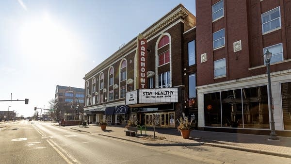 A marquee sign reads "Stay healthy. See you again soon."