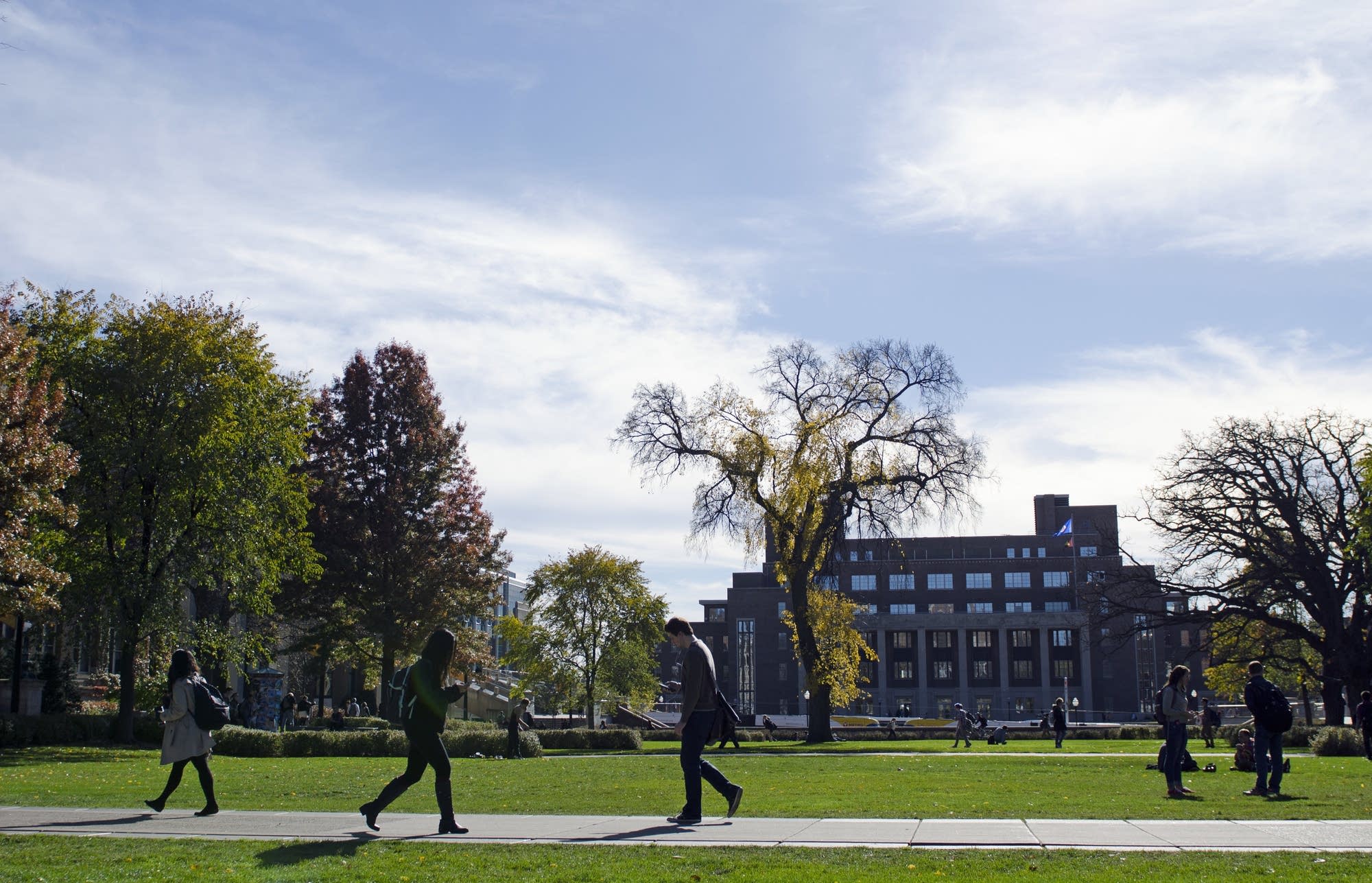 People walk in front of Coffman Memorial Union.