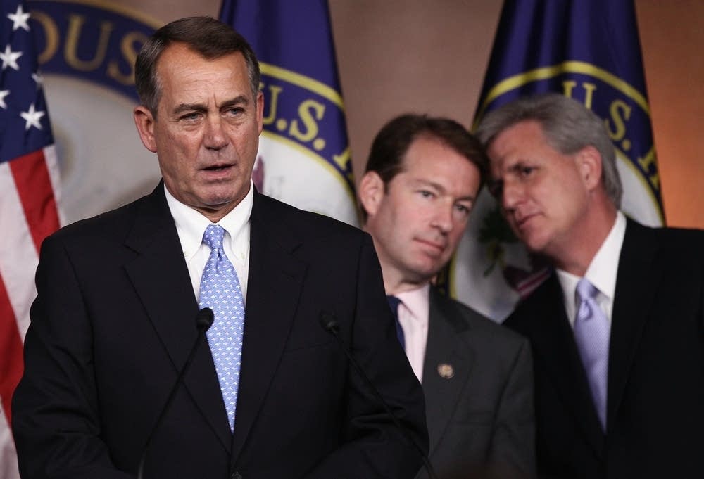 Boehner delays debt vote