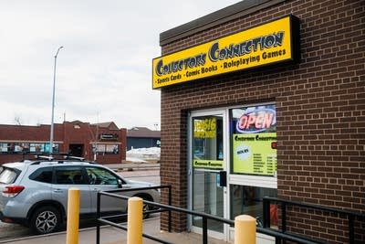 The brick exterior of a record store on a commercial street