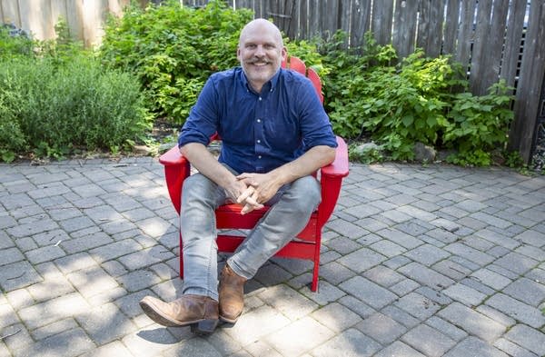A man sits in a chair