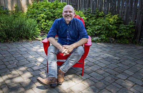 A man sits in a chair