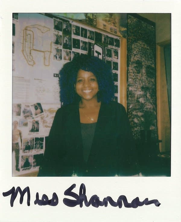 a woman posing in a polaroid photo in the carbon sound studio