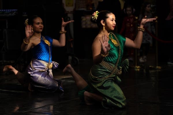 Two women dance on a stage