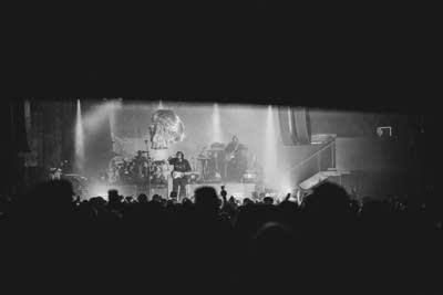 Leon Thomas performing on stage