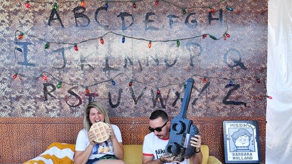 Fans pose at the many photo-op stations at the Netflix's "Stranger Things" Season 3 Fun Fair at Santa Monica Pier on June 29, 2019 in Santa Monica, California. 