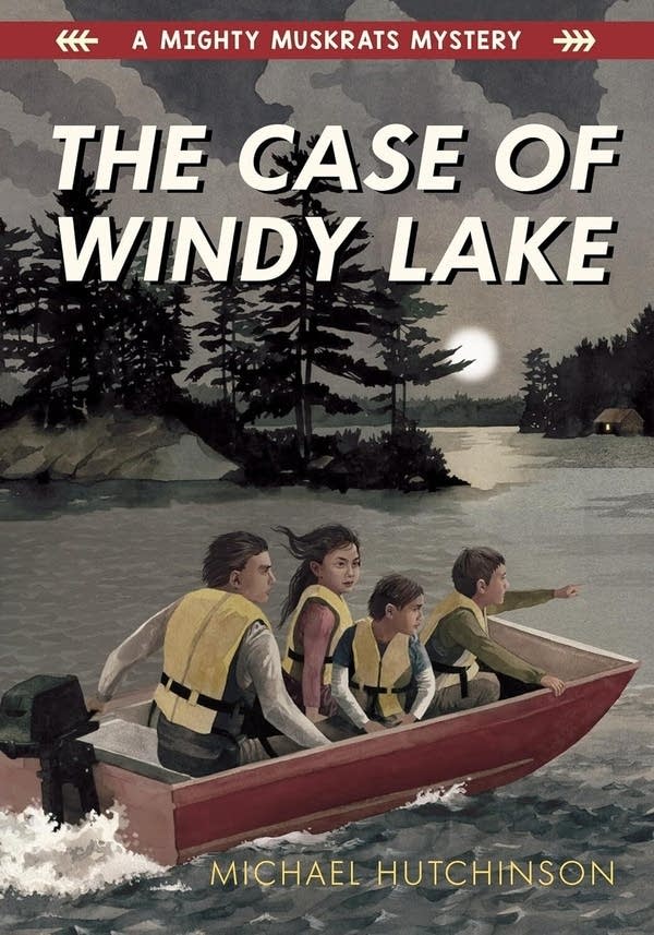 A book cover with the title "The Case of Windy Lake." On it, four kids ride in a boat across a lake at nighttime.