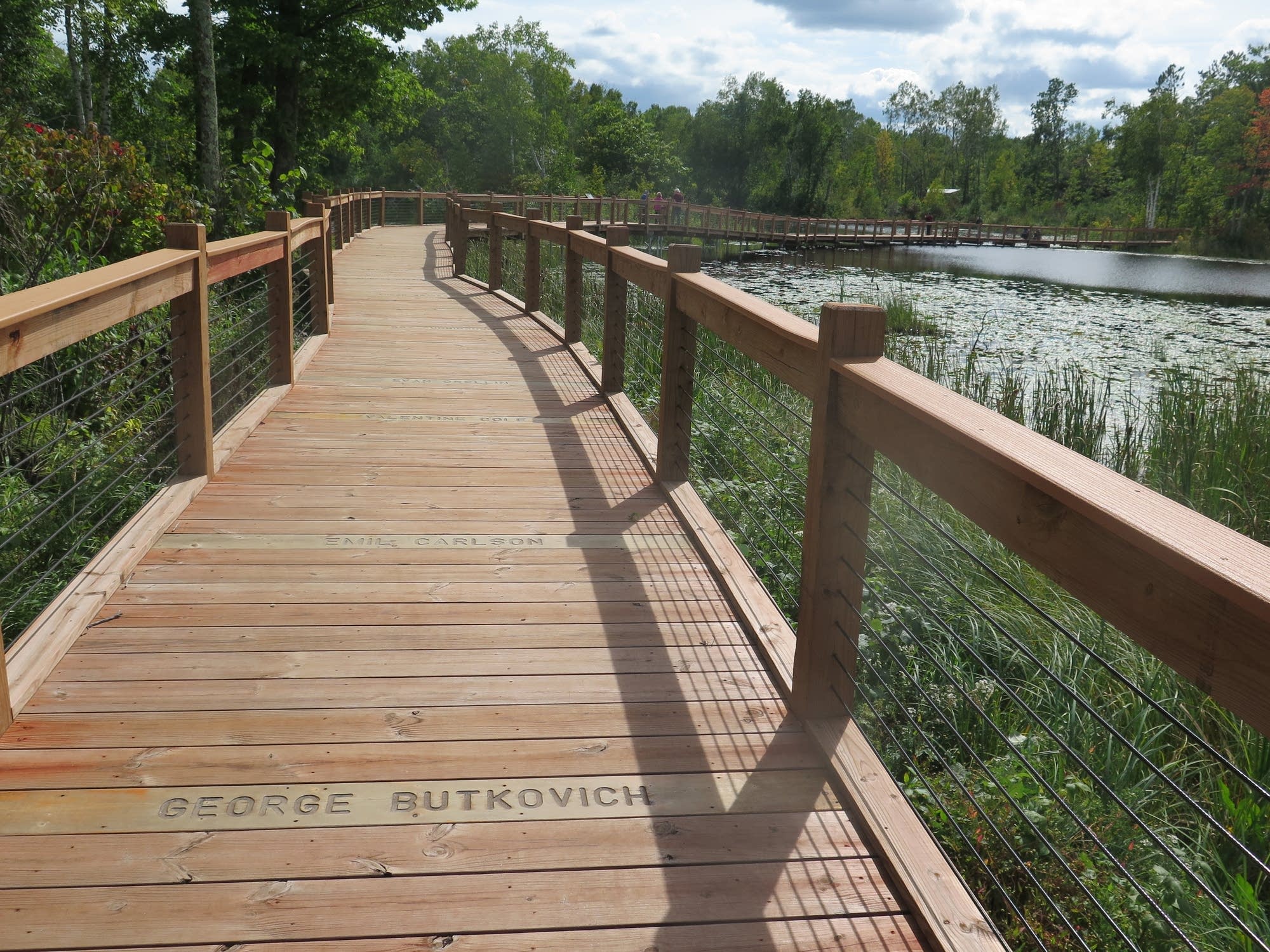 A boardwalk crosses Milford Lake, which filled in after the mine closed.