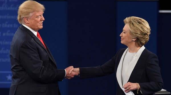 Presidential candidates Hillary Clinton and Donald Trump shake hands after the second presidential debate.