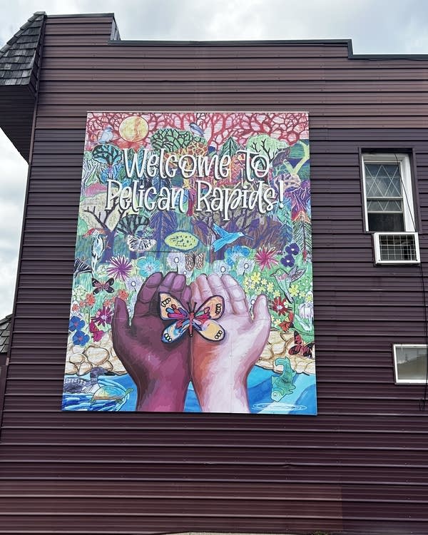 A mural painting on the side of a building.