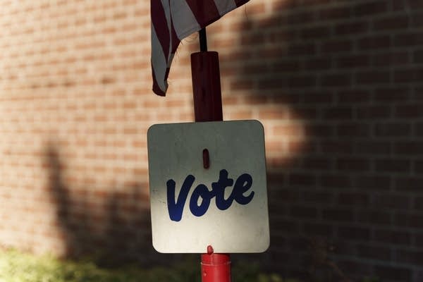 A sign reads vote