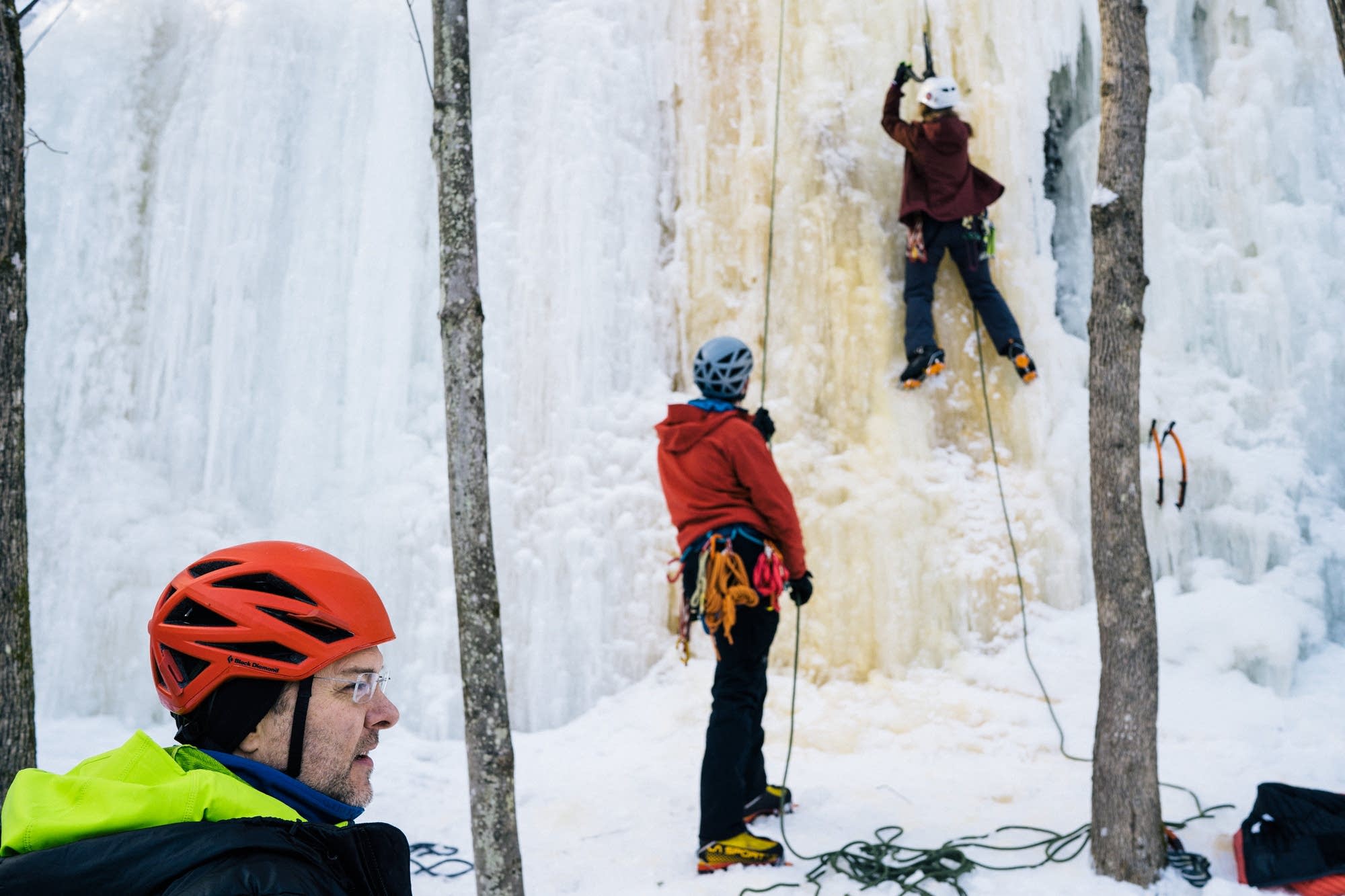 James Loveridge, left, helps beginner ice climbers learn the ropes.