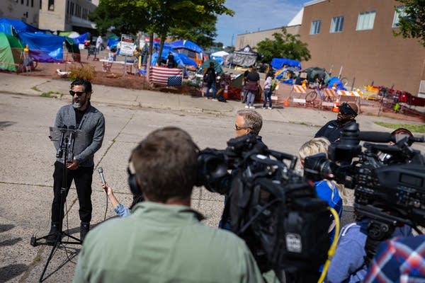 A man speaks at a press conference
