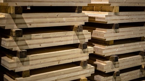 Above, cross-laminated timber stacked at a manufacturing facility in Russia.