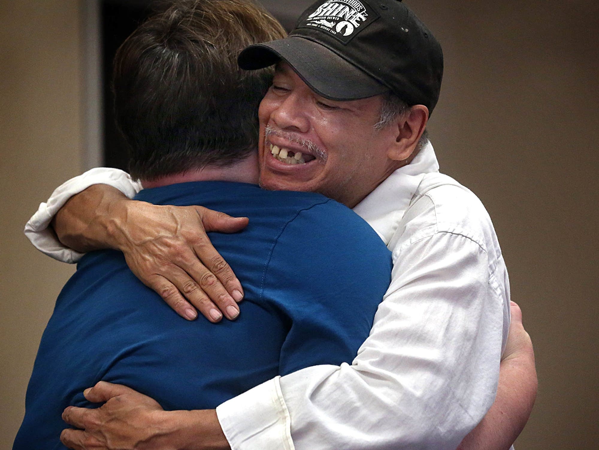 Bill Jones embraces Mobile Mender founder Michelle Ooley.