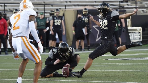 Vanderbilt place kicker Sarah Fuller kicks an extra point