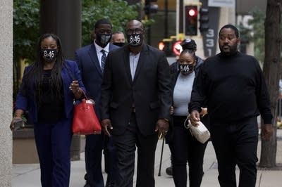 A group of people walking.