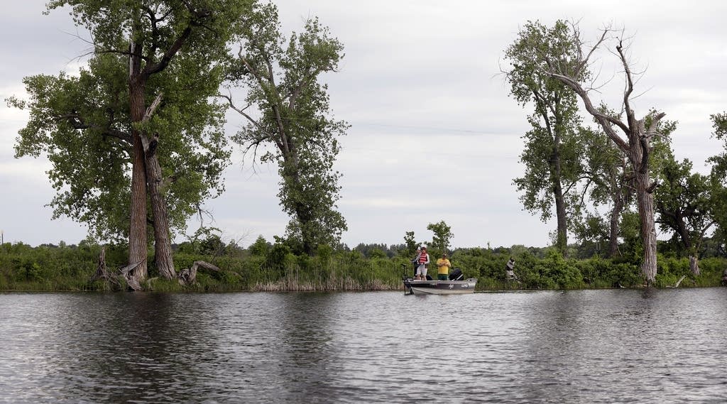 A team from Hawley Minn fishes close to shore in the early evening