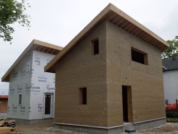 two partially constructed houses 