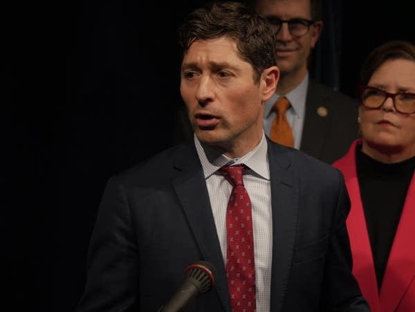 A man speaks at a press conference
