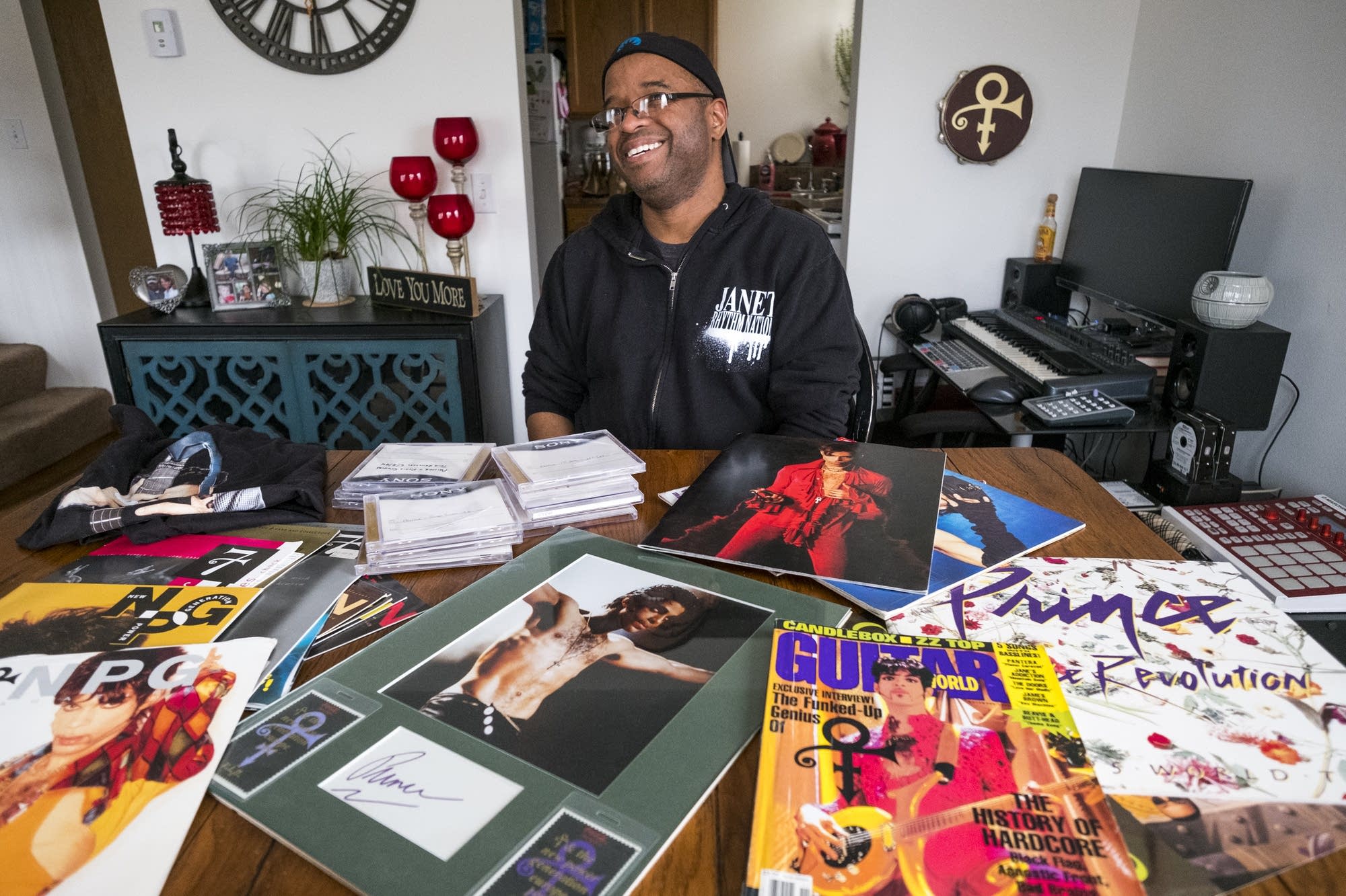 Terry Gray sits with some of his Prince memorabilia.