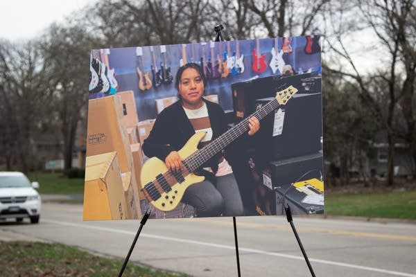 A photo of a person playing the guitar 