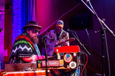 A duo performs on stage.