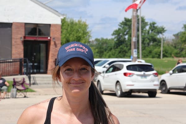 A woman smiles for a photo