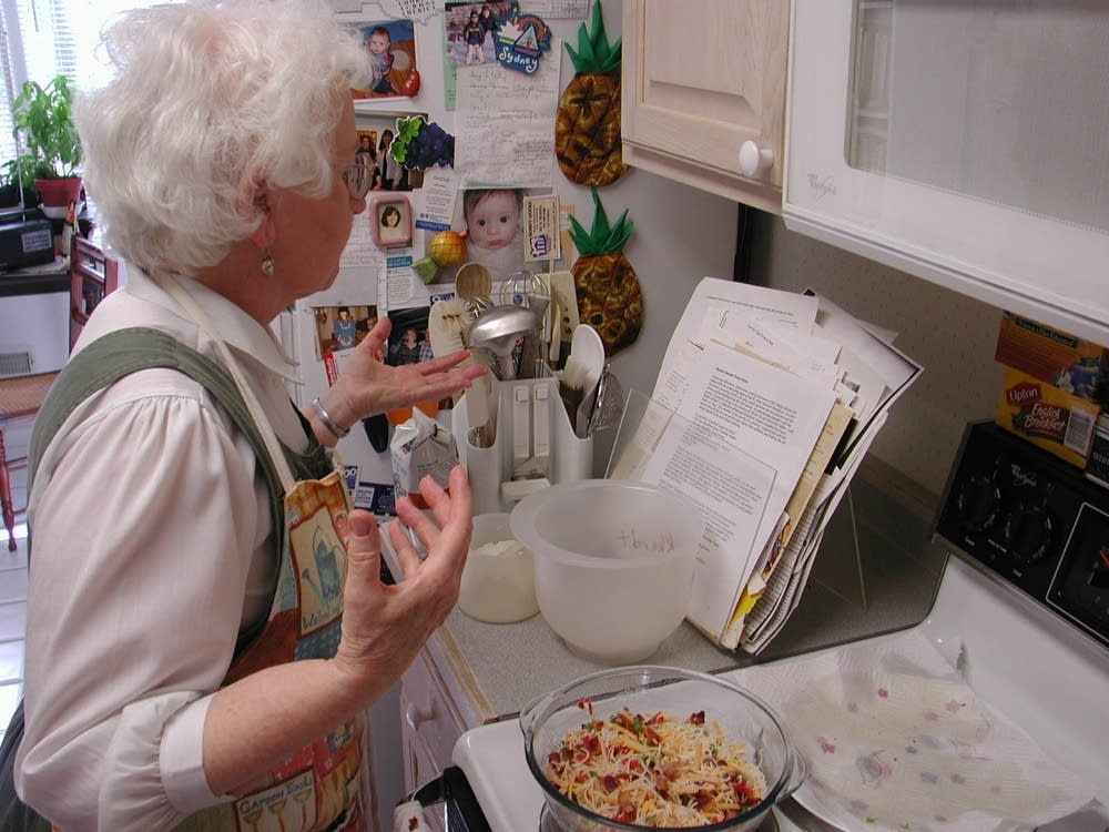 Ann Burckhardt mixes ingredients for before baking