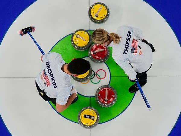 Two curlers compete in a match
