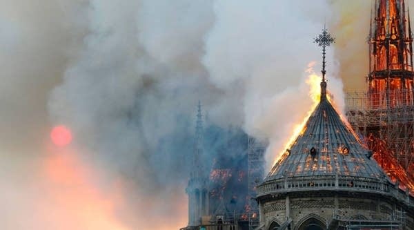 Flames burn the roof of the landmark Notre-Dame Cathedral in central Paris on April 15, 2019, during a fire. - A major fire broke out at the landmark Notre-Dame Cathedral in central Paris sending flames and huge clouds of grey smoke billowing into the sky, the fire service said. The flames and smoke plumed from the spire and roof of the gothic cathedral, visited by millions of people a year, where renovations are currently underway.