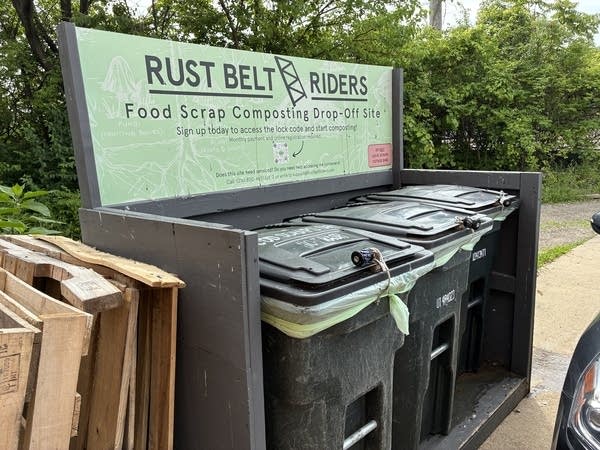 A row of black bins filled with food scraps are filling up at the drop-off site at the headquarters of Rustbelt Riders.