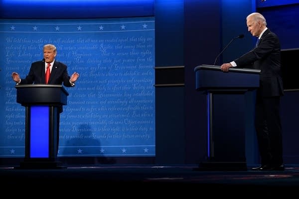 President Donald Trump speaks as Democratic presidential candidate and former Vice President Joe Biden looks on, during the final presidential debate on Thursday.
