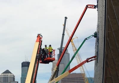 Cranes on stadium exterior