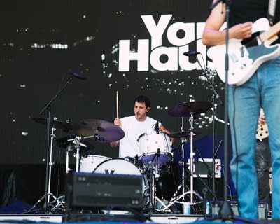 the band yam haus performing on stage