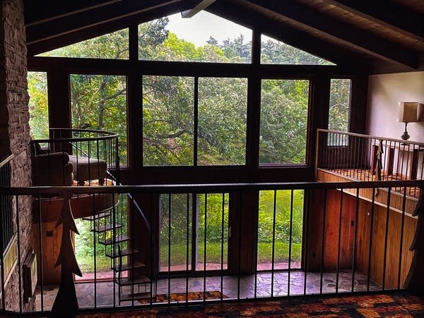 Pachyderm living quarters with floor-to-ceiling windows and spiral stairs