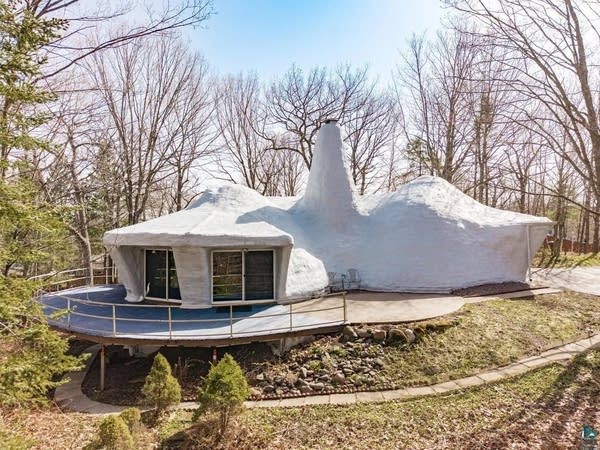 A white "Flintstone" shaped house for sale in Duluth.