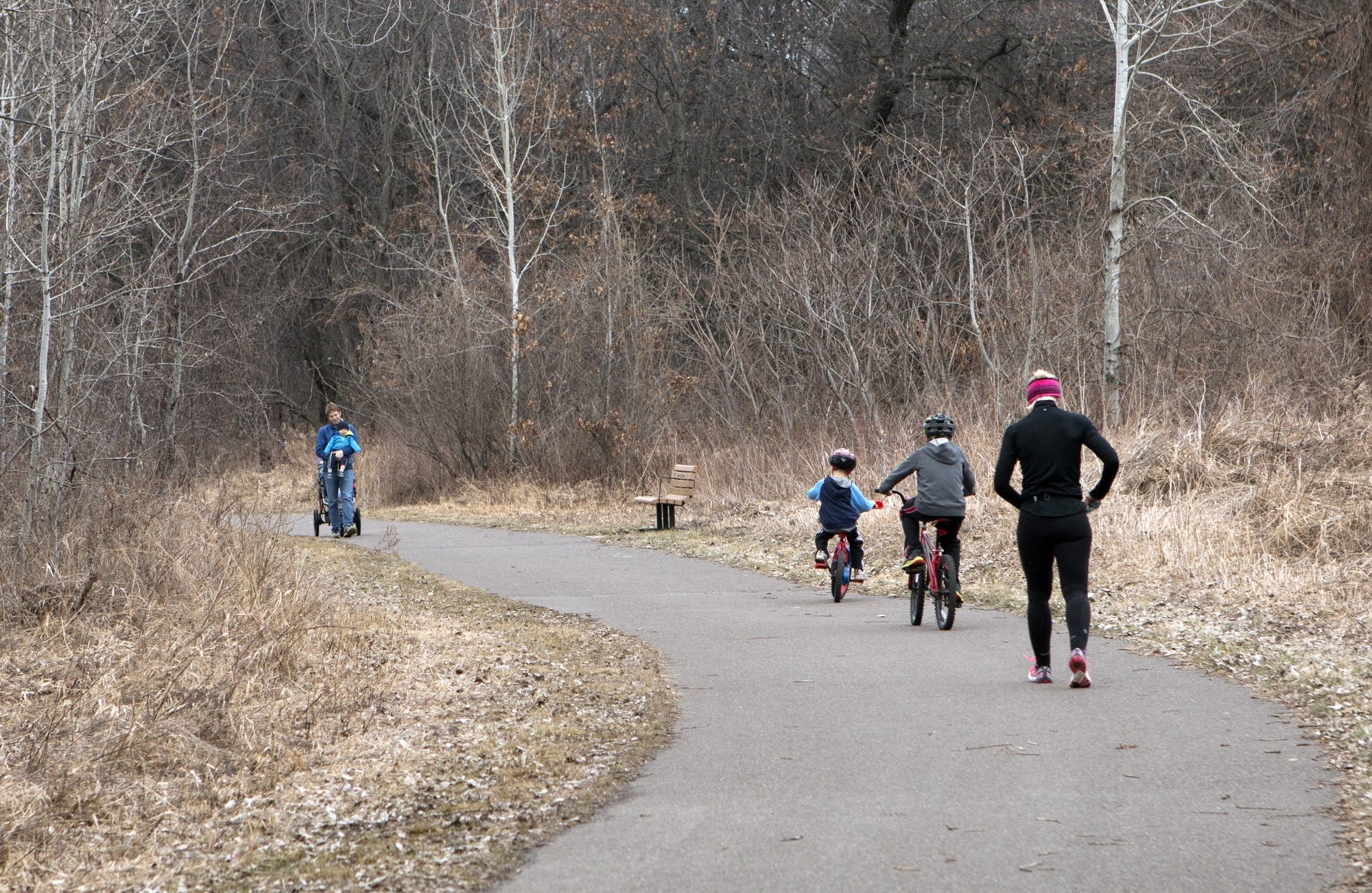 Walkers and bikers fill the trails instead of cross-country skiers.