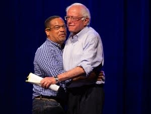 Rep. Keith Ellison and Sen. Bernie Sanders hug.