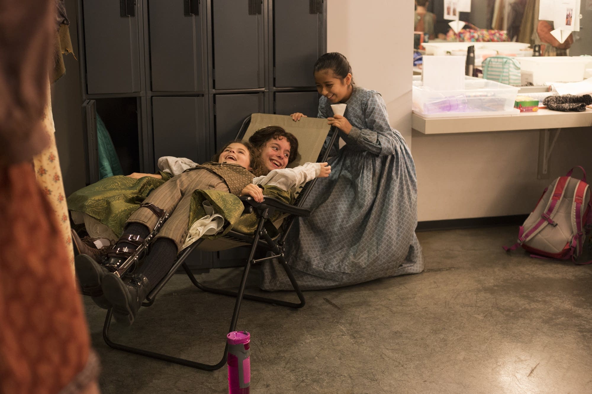 Sophie Jones, Elena Ruch and Carolina Sierra play in their dressing room.