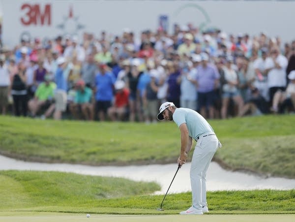 Matthew Wolff putts for an eagle on the 18th hole