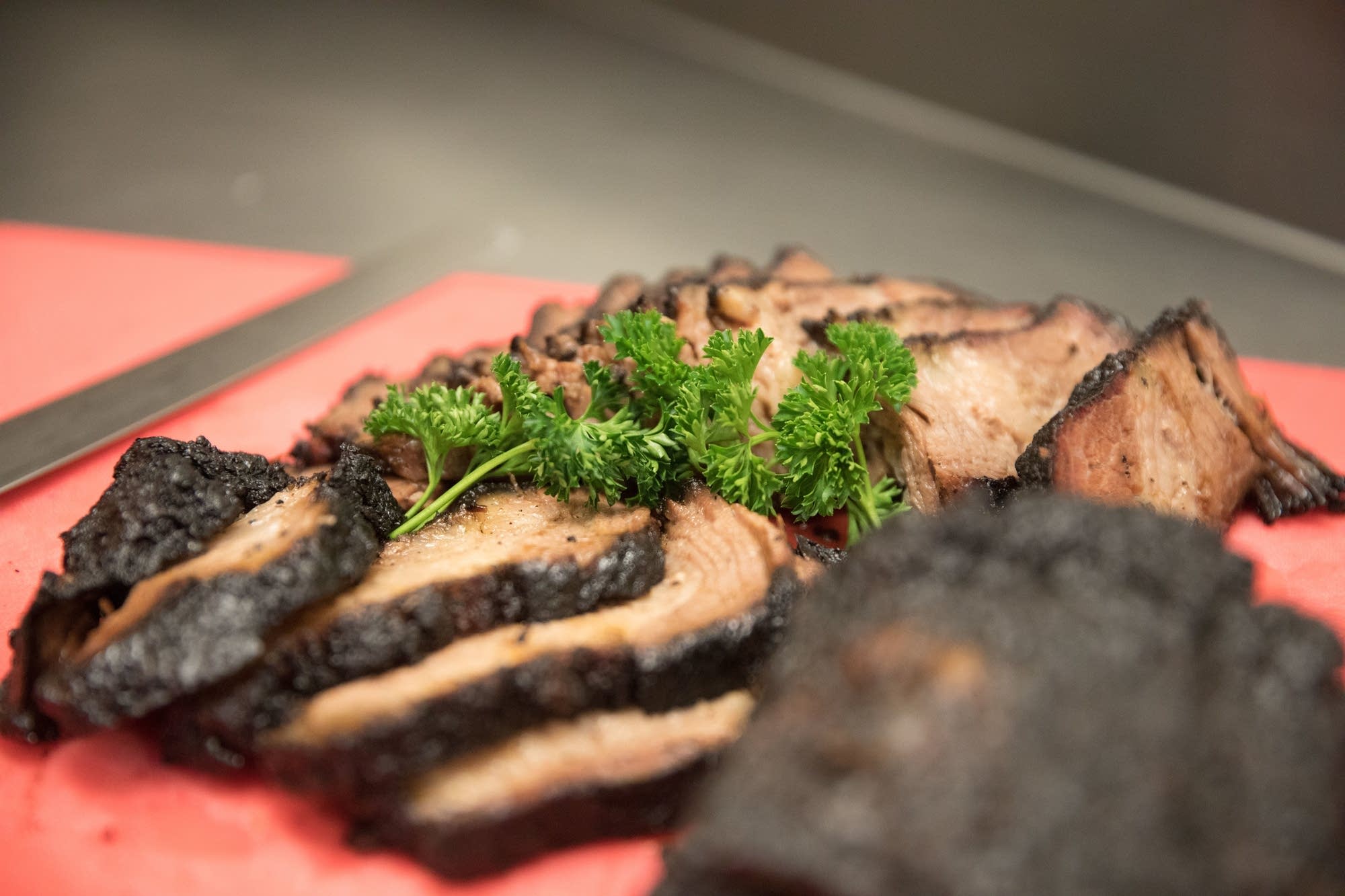 Beef brisket is served to members of the Onyx Culinary Collective.