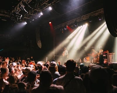 Khruangbin performing on stage