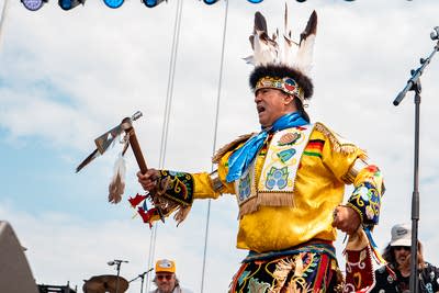 Dylan Jennings Blessing and Bizhiki performing on an outdoor stage