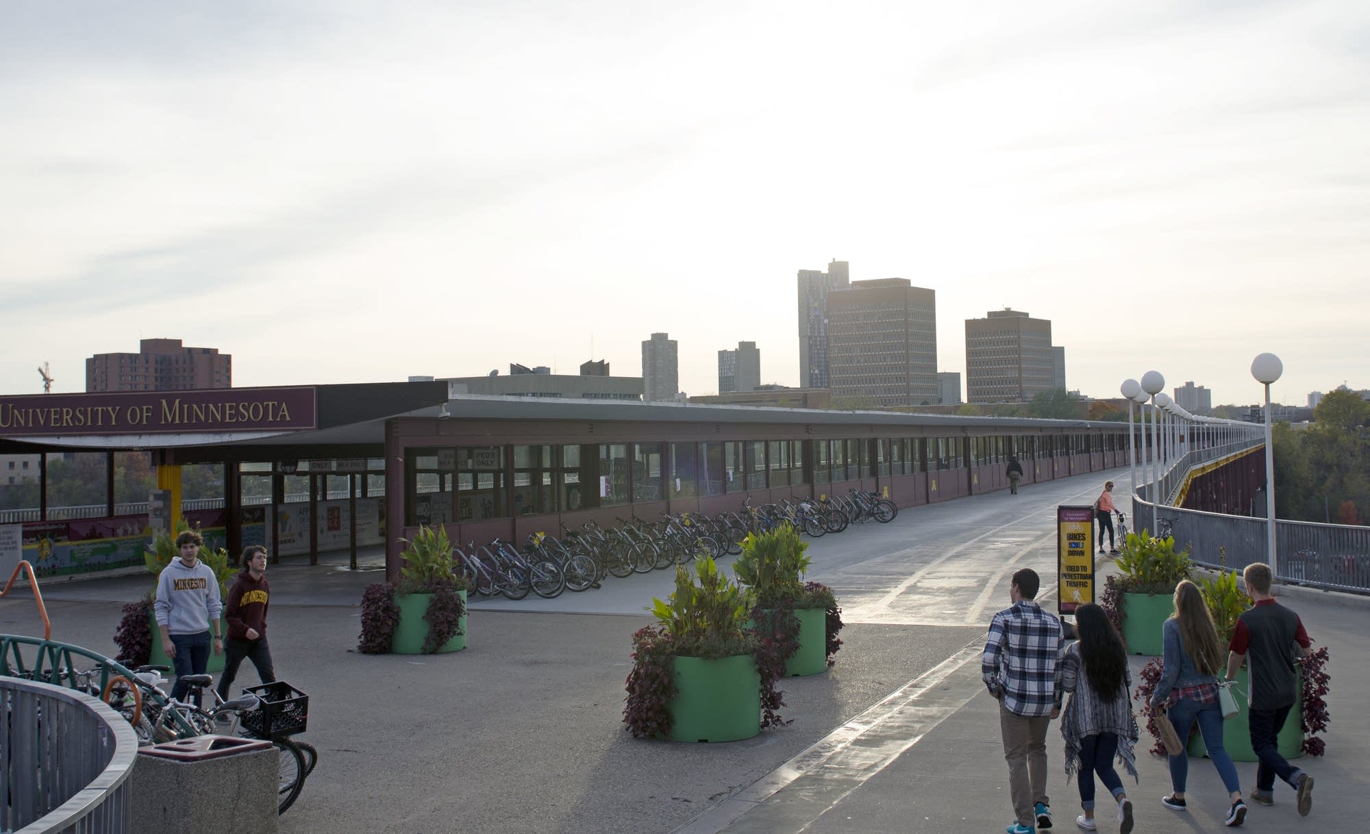 People walk near the Washington Avenue Bridge